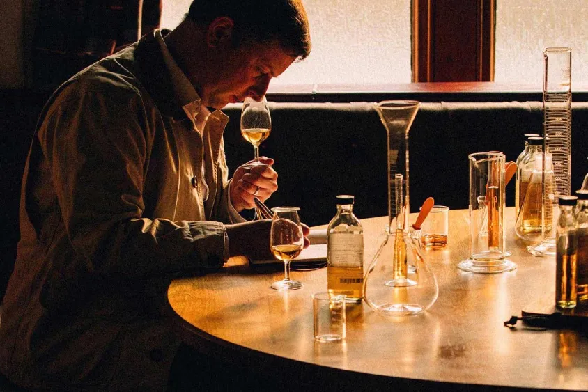 Ardray master blender nosing liquid in glass